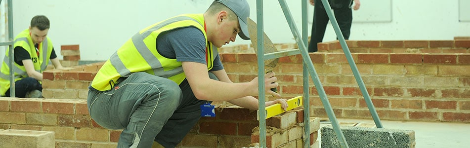 student bricklaying